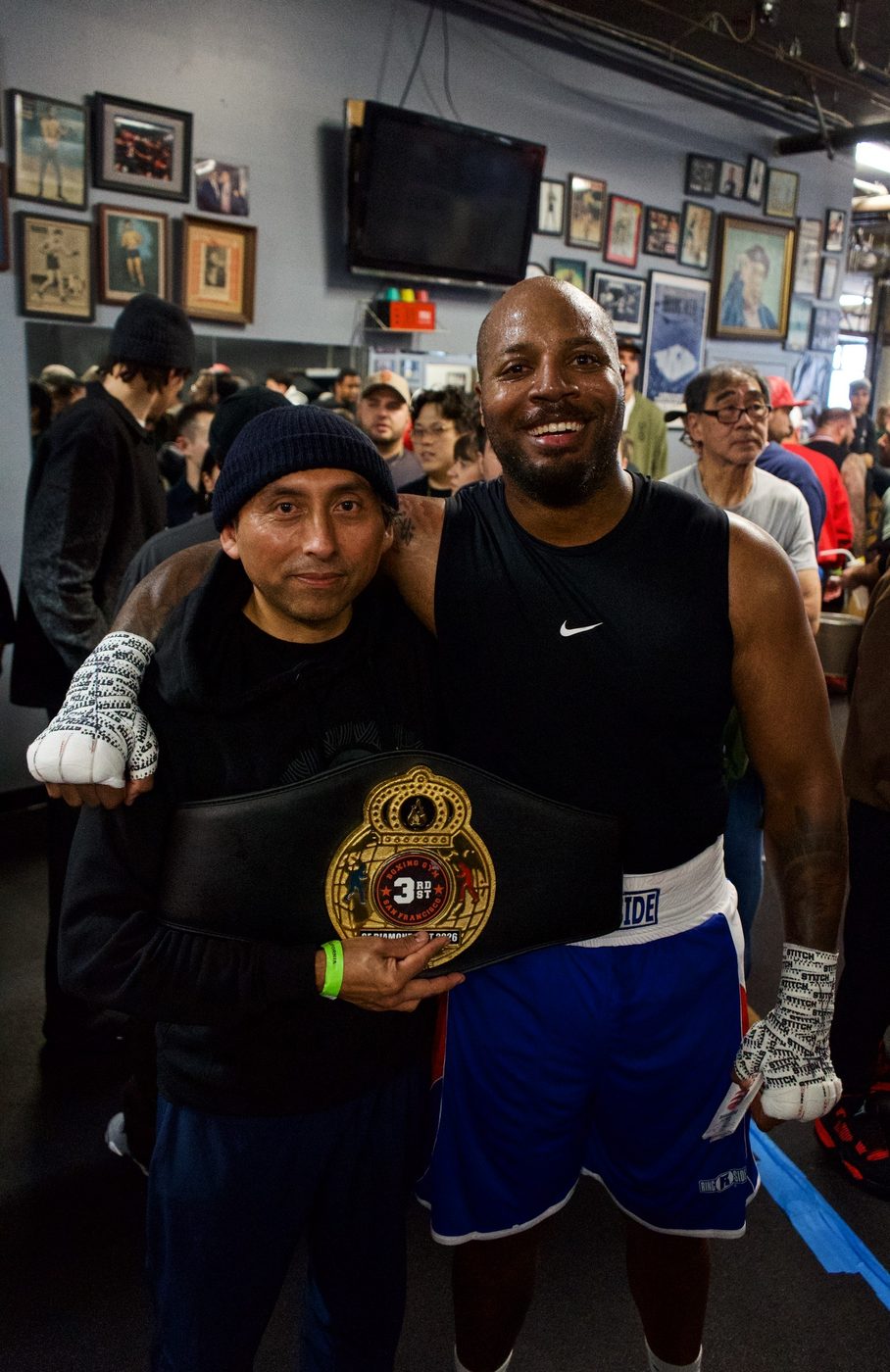 Coach and boxer with the championship belt at Gopa Boxing Club