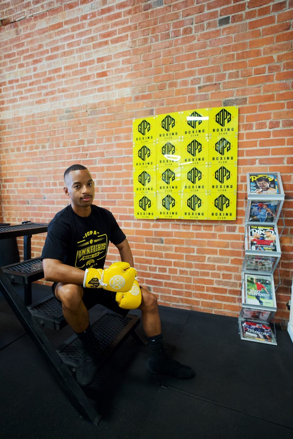 Gopa Boxing Club member with gloves at the gym in Oakland