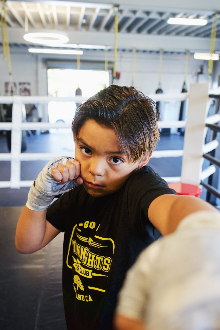 Young boxer holding guard in a self defense class in Oakland
